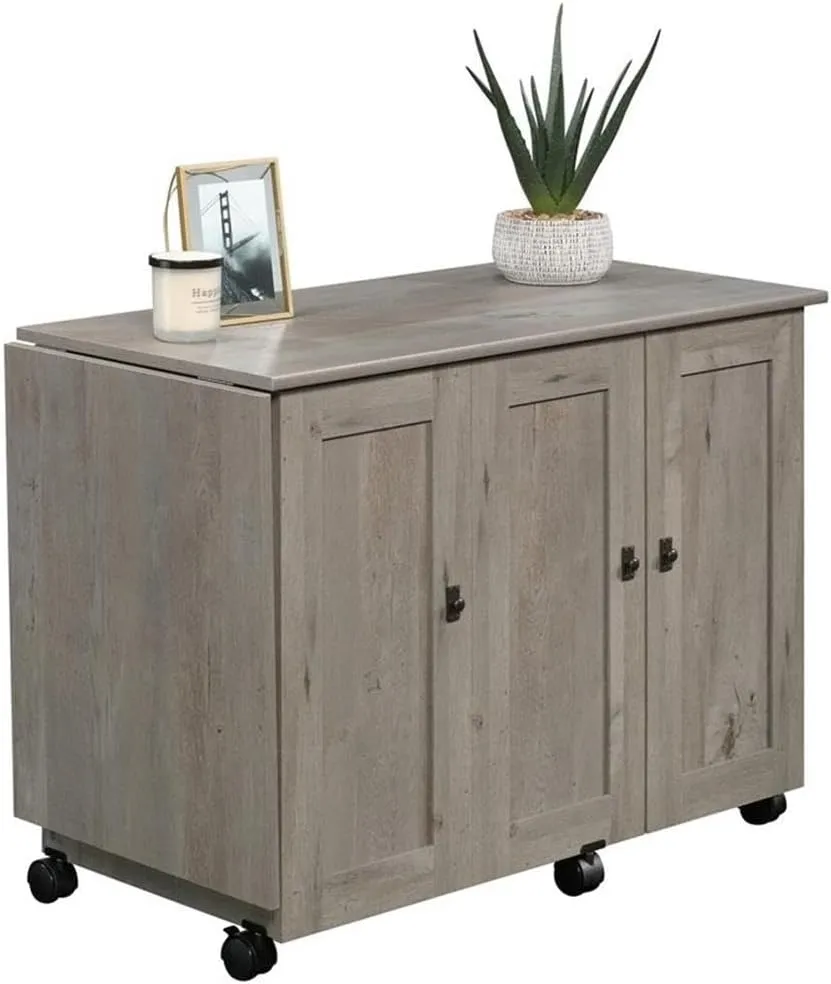 BOWERY HILL Contemporary Engineered Wood Sewing Craft Table with 2 Doors, 2 Storage Bins, Hidden Shelf, 2 Adjustable Shelves, Easy-Roll Casters, in Mystic Oak Finish